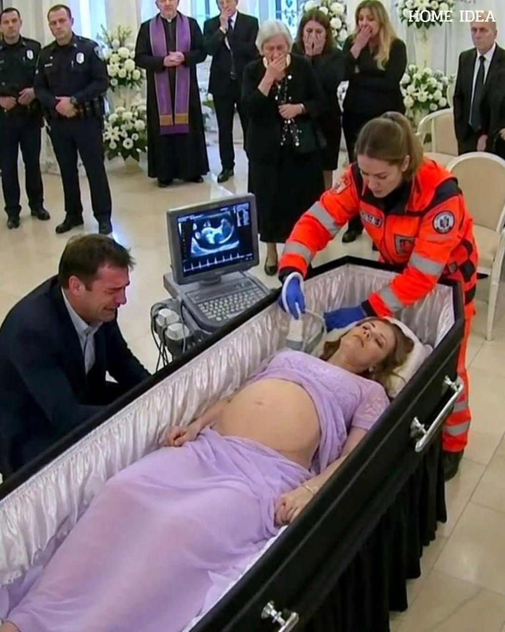 While they were preparing his pregnant wife’s body for cremation, the husband asked to open the coffin one last time