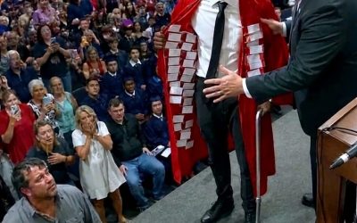 My Disabled Son Walked Graduation In A Scarlet Gown While The Room Laughed, But When He Opened It To Reveal Thirty-Seven Names The School Had Silenced, The Principal Tried To Stop Him, Families Rose From The Crowd, And His Father Finally Faced What That Cane Had Been Carrying