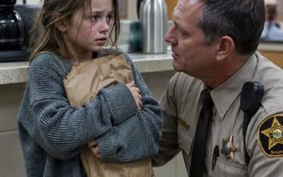 She was only seven when she walked nine blocks in the dark with her baby brother hidden in a grocery bag, stepped barefoot into the Briar Glen Police Department at 9:46 p.m., and whispered, “Please… I brought him here alone,” but the real terror began when Deputy Evan Hollis opened the folded note from her mother, realized the child had followed a secret escape plan perfectly, and then saw the man the note warned about walk through the station doors acting calm enough to fool everyone — except the little girl who already knew exactly what his smile meant