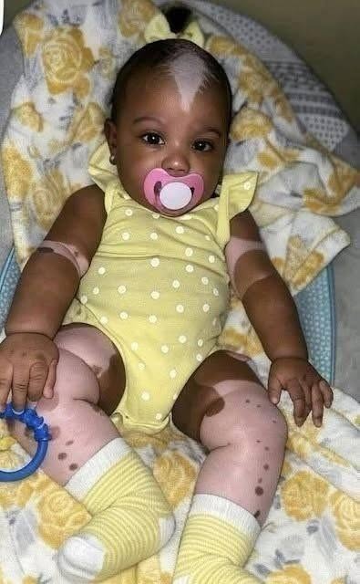 Young woman puts daughter inside the fir… See more